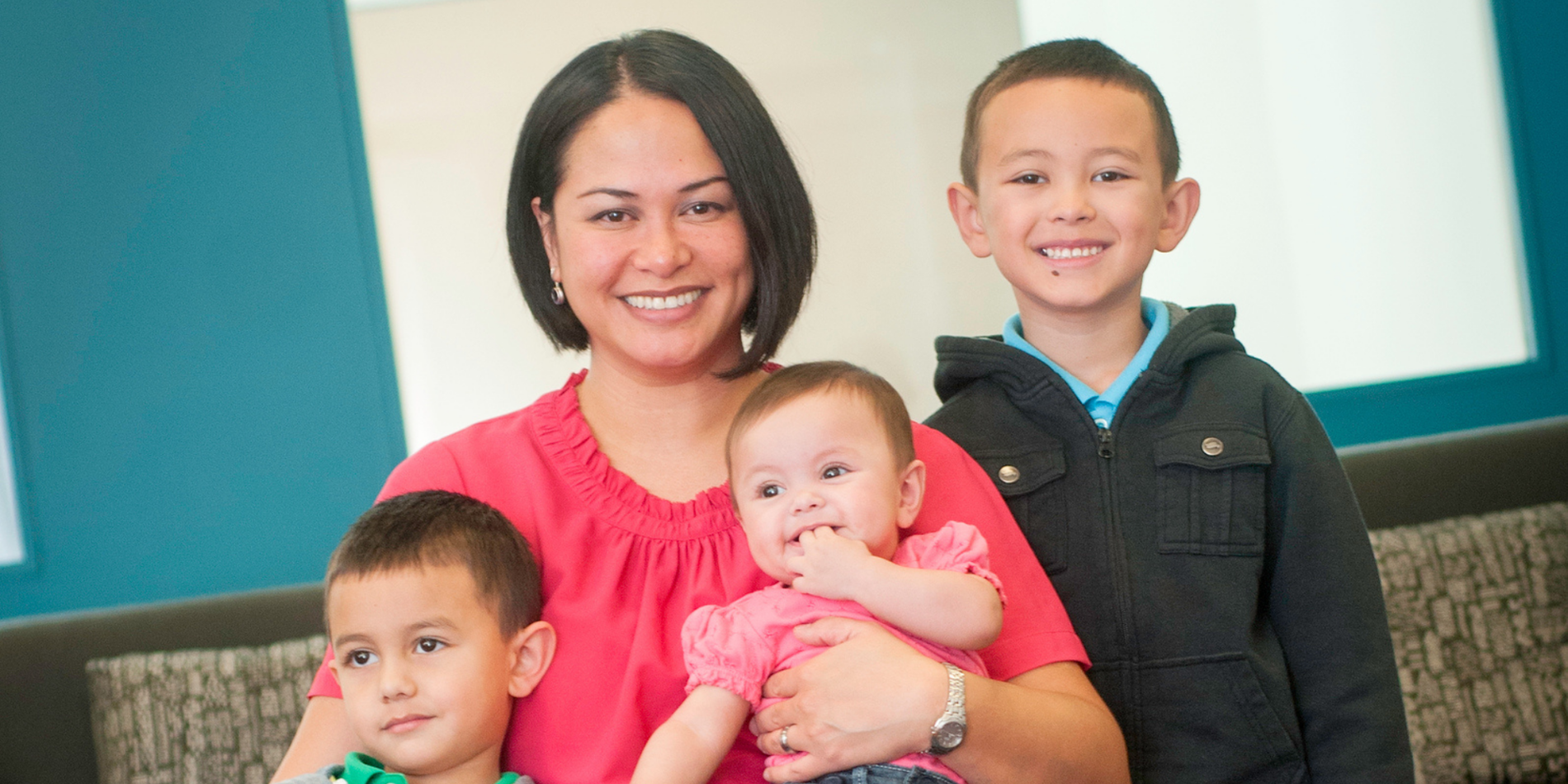 Chrisha Tung posing for the camera with her three kids