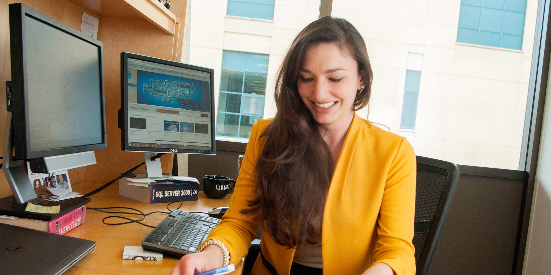 Female employee working at her office desk