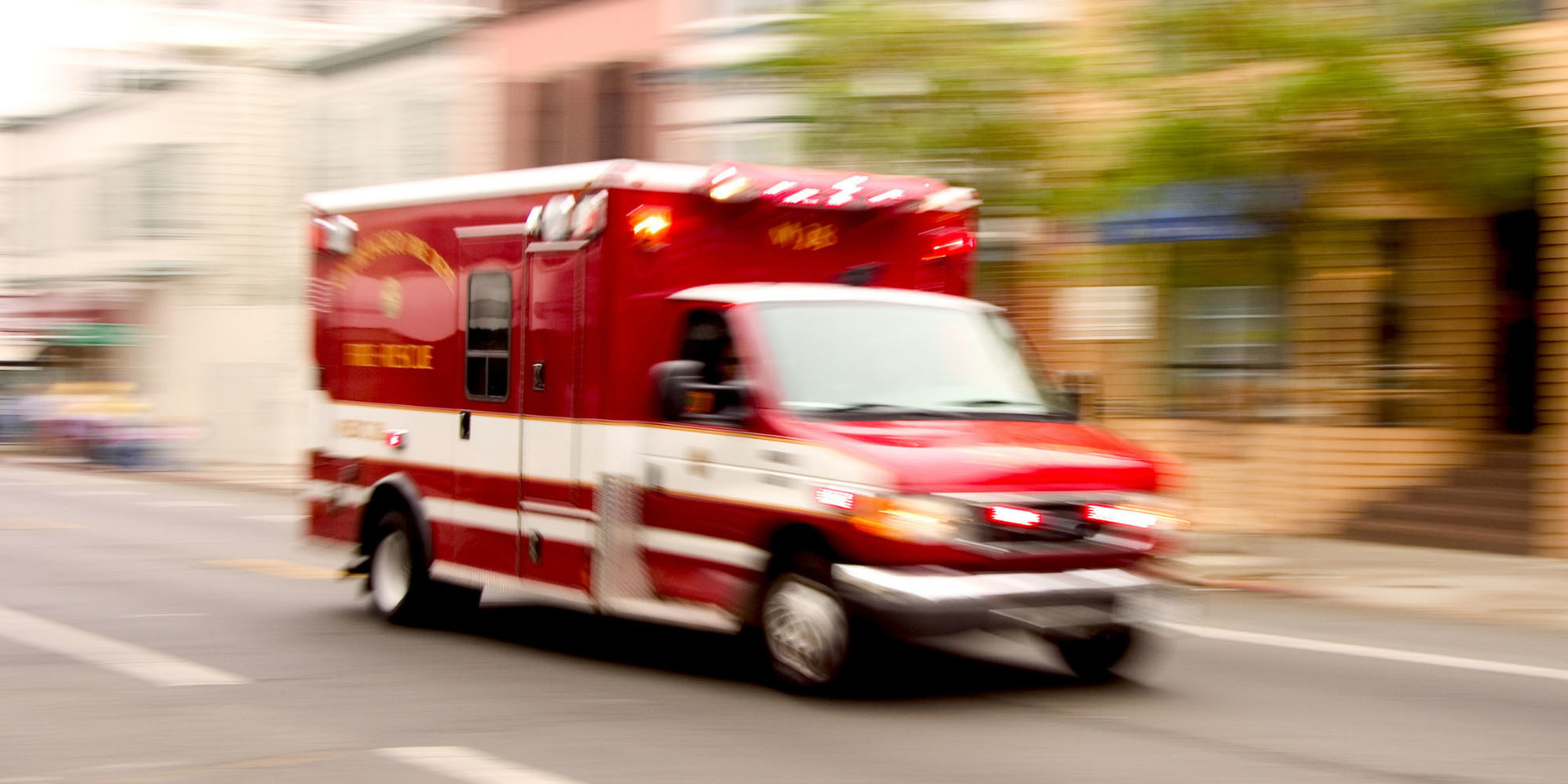 Ambulance speeding down the road