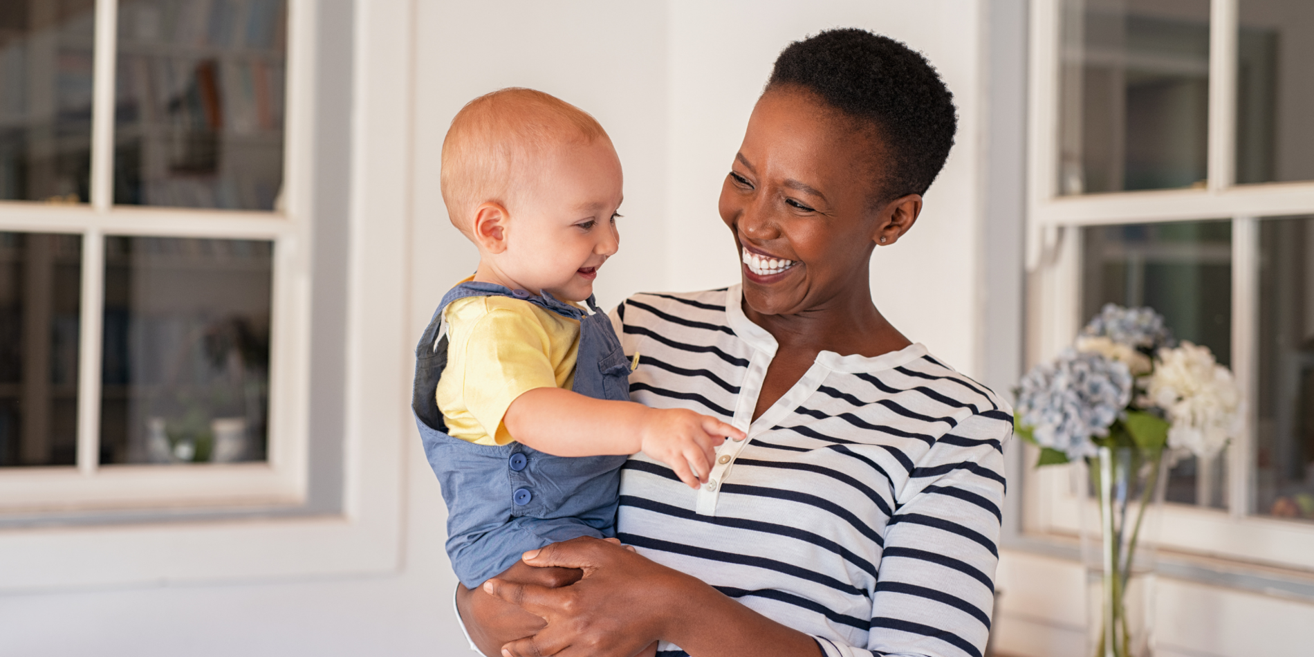African mother holding adopted child