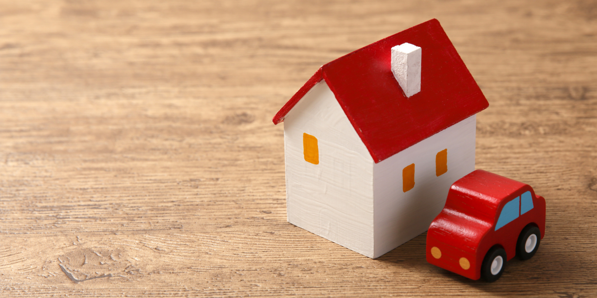House and car figurine next to each other