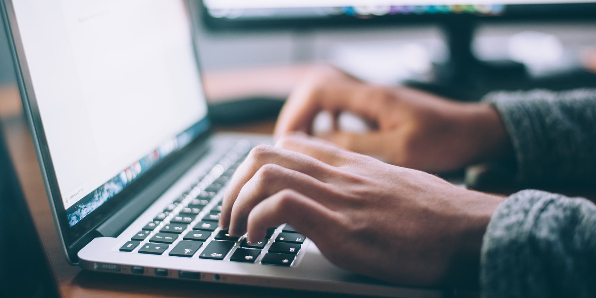 Close up of person using a laptop