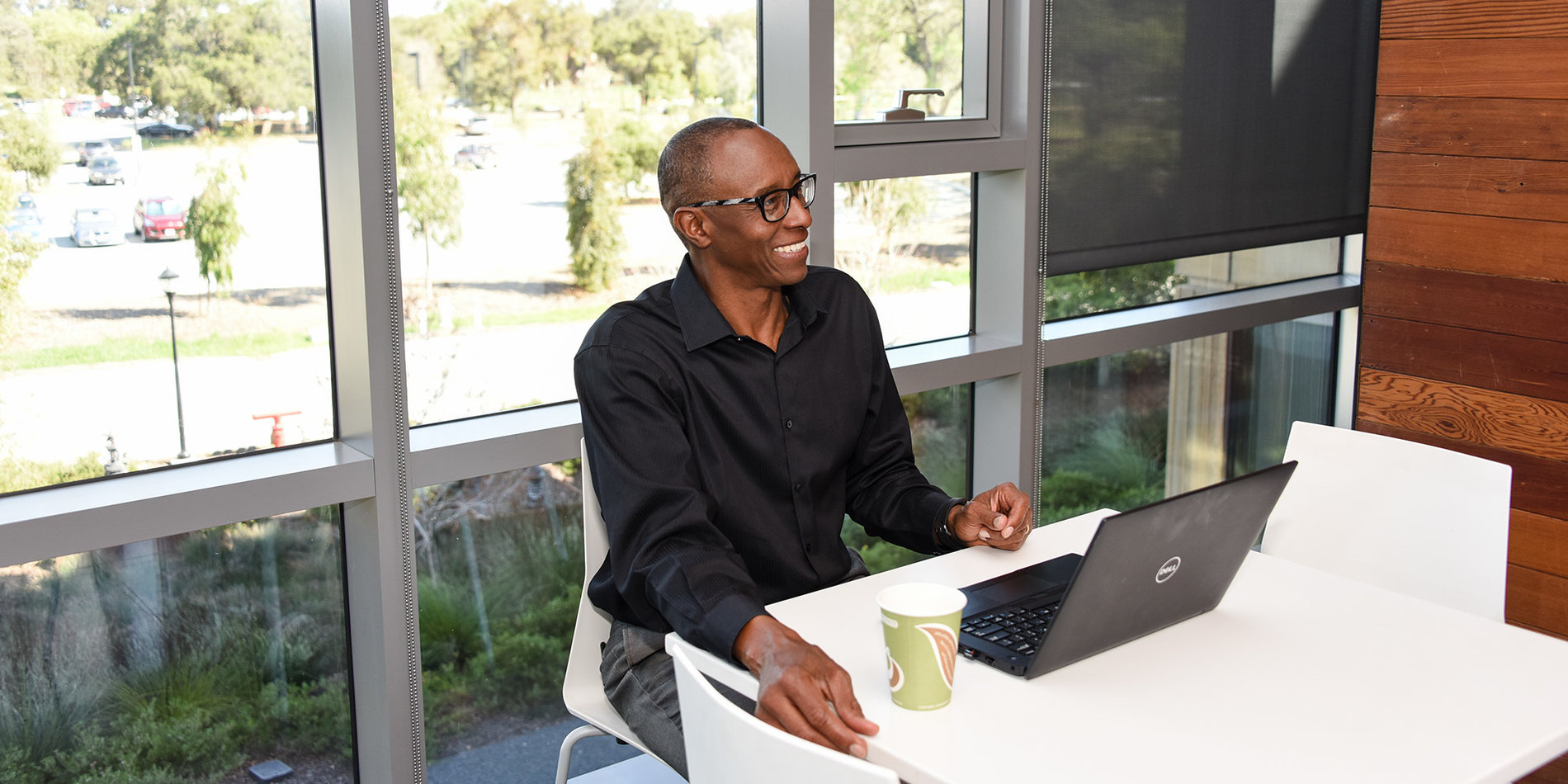 African-American male employee at a desk in Redwood City office