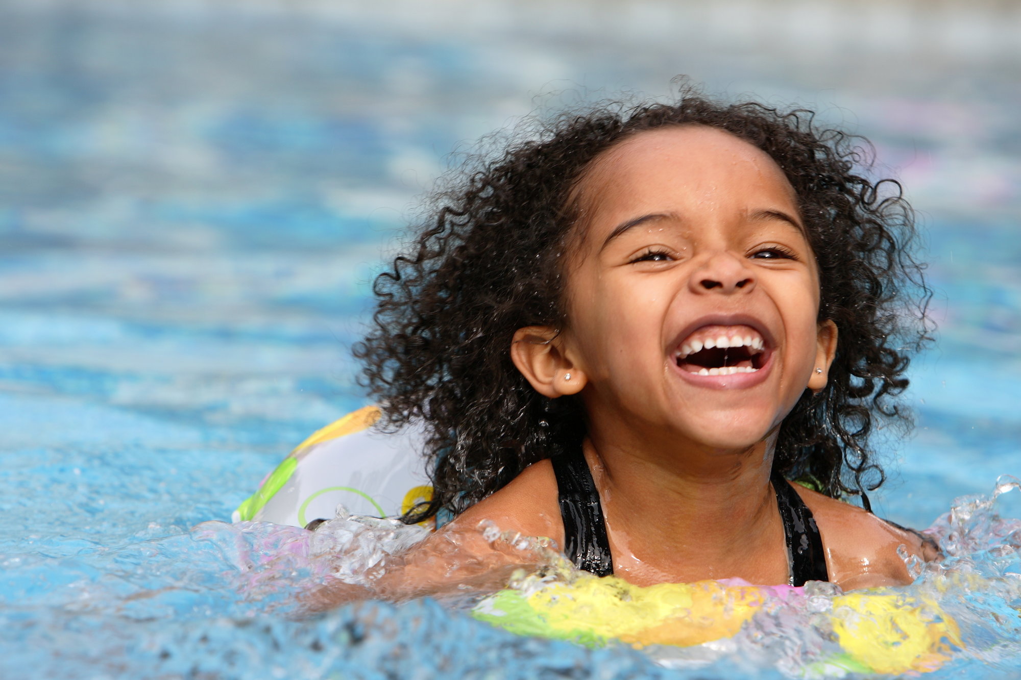 girl swimming happy 
